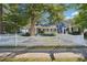 Newly renovated home with a white picket fence and mature trees at 910 E Lake Dr, Decatur, GA 30030