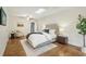 Main bedroom with hardwood floors, ceiling fan, and skylight at 910 E Lake Dr, Decatur, GA 30030