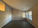 Bright living room featuring large windows and laminate flooring at 2070 Young Rd, Lithonia, GA 30058