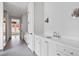 Modern bathroom with white vanities and gray tile floors at 90 Sheridan Dr, Atlanta, GA 30305