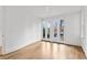 Bright bedroom with hardwood floors and French doors leading to the backyard at 90 Sheridan Dr, Atlanta, GA 30305