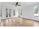 Light-filled bedroom featuring hardwood floors and French doors at 90 Sheridan Dr, Atlanta, GA 30305