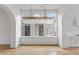 Bright dining room with hardwood floors and a stunning chandelier at 90 Sheridan Dr, Atlanta, GA 30305