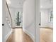 Curved hallway with hardwood floors and access to stairs at 90 Sheridan Dr, Atlanta, GA 30305