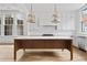 Modern kitchen with white cabinets, quartz countertops and a wood island at 90 Sheridan Dr, Atlanta, GA 30305