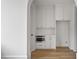 Small kitchen area with white cabinets and built in microwave at 80 Sheridan Dr, Atlanta, GA 30305