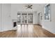 Light-filled living room with hardwood floors, fireplace, and French doors at 90 Sheridan Dr, Atlanta, GA 30305