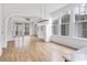 Open living room boasting hardwood floors and access to a balcony at 90 Sheridan Dr, Atlanta, GA 30305