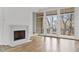 Living room features hardwood floors, fireplace, and French doors to balcony at 90 Sheridan Dr, Atlanta, GA 30305