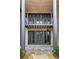 Stone patio with dark-framed doors and a metal railing at 90 Sheridan Dr, Atlanta, GA 30305