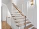 Elegant staircase with hardwood steps and white railings at 90 Sheridan Dr, Atlanta, GA 30305