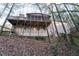 Rear exterior view of the home showing the deck and screened porch at 8760 S Mount Dr, Alpharetta, GA 30022