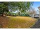 Spacious backyard with a deck and mature trees at 204 Gold Valley Xing, Canton, GA 30114