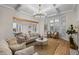 Bright living room with coffered ceiling, large windows, and hardwood floors at 204 Gold Valley Xing, Canton, GA 30114