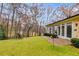 Landscaped backyard with patio, trees, and a swing at 4010 Paper Mill Se Rd, Marietta, GA 30067