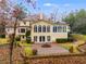 Back of house with patio, fountain, and sunroom addition at 4010 Paper Mill Se Rd, Marietta, GA 30067