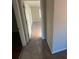 Carpeted hallway with doors leading to bedrooms at 5979 Rex Ridge Ct, Rex, GA 30273