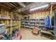 Unfinished basement area used for storage, with shelving units and concrete flooring at 242 Viola Dr, Dallas, GA 30157