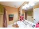 Clean bathroom with a shower/tub combination, vanity, and mirror at 242 Viola Dr, Dallas, GA 30157