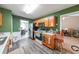 Bright kitchen featuring oak cabinets, stainless steel appliances, and dining area at 242 Viola Dr, Dallas, GA 30157