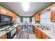 Functional kitchen with oak cabinets, white countertops, and eat-in area at 242 Viola Dr, Dallas, GA 30157