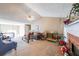 Inviting living room with vaulted ceiling, cozy fireplace, and ample natural light at 242 Viola Dr, Dallas, GA 30157