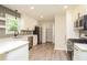 Modern white kitchen with stainless steel appliances at 3283 Clearview Sw Dr, Marietta, GA 30060