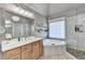 Modern bathroom with double vanity, jacuzzi tub, and separate shower at 3350 Vista Creek Dr, Dacula, GA 30019