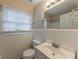 Clean bathroom with white tile, vanity, and window at 3390 Glenview Sw Cir, Atlanta, GA 30331