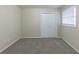 Spacious bedroom with grey carpet and double door closet at 3390 Glenview Sw Cir, Atlanta, GA 30331