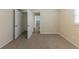 Bright bedroom featuring carpet, closet, and access to hallway at 3390 Glenview Sw Cir, Atlanta, GA 30331