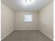 Simple bedroom with grey carpet and window with blinds at 3390 Glenview Sw Cir, Atlanta, GA 30331