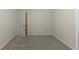 Bright bedroom featuring grey carpet and access to hallway at 3390 Glenview Sw Cir, Atlanta, GA 30331