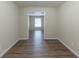 Bright dining room features dark wood-look vinyl flooring and access to other rooms at 3390 Glenview Sw Cir, Atlanta, GA 30331