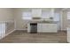 Modern kitchen with white cabinets, granite counters, and stainless steel appliances at 3390 Glenview Sw Cir, Atlanta, GA 30331