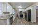 Updated kitchen featuring stainless steel appliances and wood-look flooring at 3390 Glenview Sw Cir, Atlanta, GA 30331