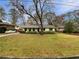 Charming ranch home with a spacious front yard and mature trees at 522 Jo Ann Se Dr, Marietta, GA 30067
