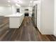 Modern kitchen with white cabinets, quartz countertops, and stainless steel appliances at 522 Jo Ann Se Dr, Marietta, GA 30067