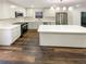 Modern kitchen with white cabinets, quartz countertops, and stainless steel appliances at 522 Jo Ann Se Dr, Marietta, GA 30067