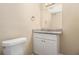 Updated half bathroom featuring granite countertop and white cabinetry at 6979 Bruce Cir, Lithonia, GA 30058