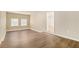 Simple bedroom with hardwood floors and neutral walls at 6979 Bruce Cir, Lithonia, GA 30058