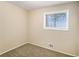 Cozy carpeted bedroom with a window and neutral decor at 6979 Bruce Cir, Lithonia, GA 30058