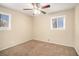 Well-lit bedroom with carpeted floors and neutral tones at 6979 Bruce Cir, Lithonia, GA 30058