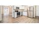 Modern kitchen with stainless steel appliances and granite countertops at 6979 Bruce Cir, Lithonia, GA 30058