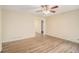 Spacious living room with hardwood floors and access to other rooms at 6979 Bruce Cir, Lithonia, GA 30058