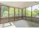 Screened-in porch with lattice and wooded backyard views at 4511 Keenly Valley Dr, Buford, GA 30519