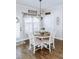 Bright breakfast nook features a charming table set and hardwood floors at 3658 Clark Hill Way, Buford, GA 30519