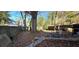 Large backyard with a wooden fence and several trees at 1041 Heritage Valley Rd, Norcross, GA 30093