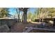 Large backyard with a wooden fence and several trees at 1041 Heritage Valley Rd, Norcross, GA 30093