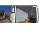 Side view of a two-story house with light gray vinyl siding at 1041 Heritage Valley Rd, Norcross, GA 30093